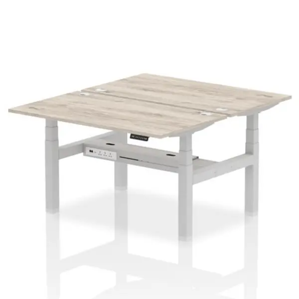 Image of Air Air Back-to-Back 1400 x 800mm Height Adjustable 2 Person Bench Desk Grey Oak Top with Cable Ports Silver Frame HASCP2P14800GRYS