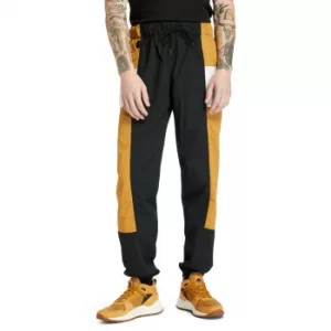 Image of Timberland Outdoor Archive Trail Tracksuit Bottoms For Men In Yellow/black Yellow/black, Size XL