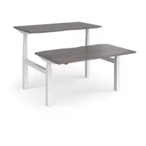 image of Elev8 Touch sit-stand back-to-back desks 1400mm x 1650mm - white frame and grey oak top