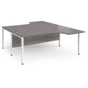 image of Maestro 25 back to back ergonomic desks 1800mm deep - white bench leg frame and grey oak top