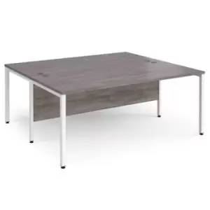 Image of Maestro 25 back to back straight desks 1800mm x 1600mm - white bench leg frame and grey oak top