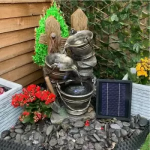 image of Tranquility Water Features - metal pouring jugs Solar Powered Water Feature