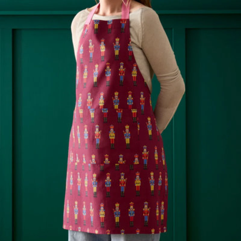Image of Catherine Lansfield Christmas Nutcracker Cotton 70X80Cm Kitchen Adult Apron Plum
