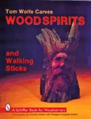 Image of tom wolfe carves wood spirits and walking sticks
