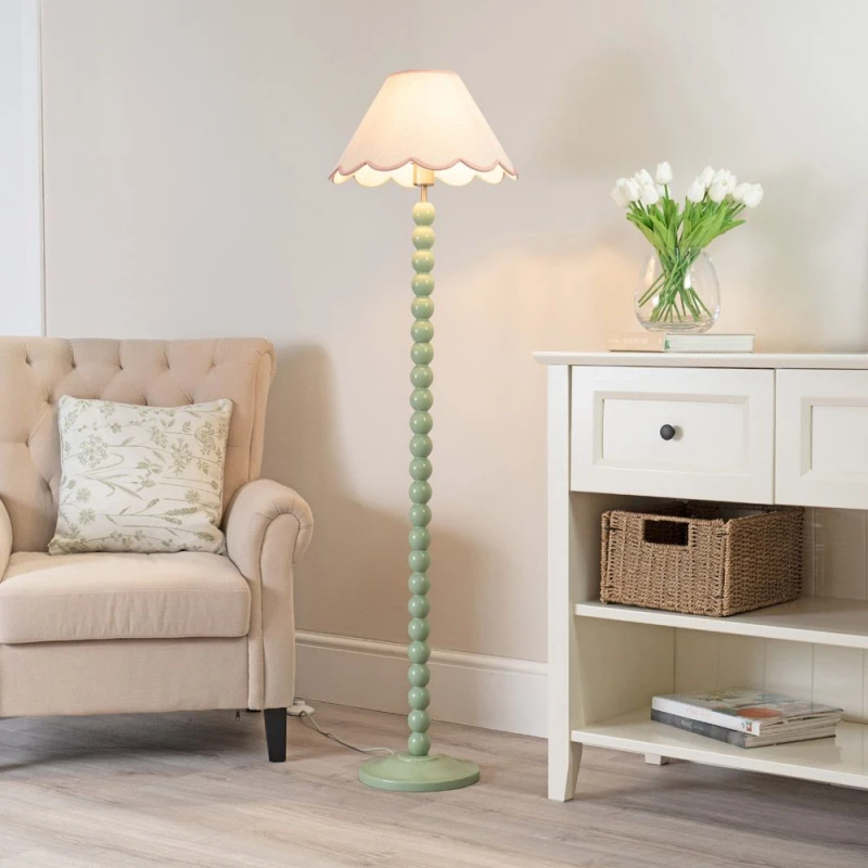 Image of ValueLights Bobbins Sage Green Floor Lamp with Tapered Natural Linen Scallop Shade Pink