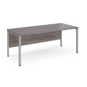 image of Maestro 25 straight desk 1800mm x 800mm - silver bench leg frame and grey oak top