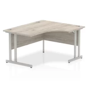 image of Impulse 1400mm Right Crescent Desk Grey Oak Top Silver Cantilever Leg