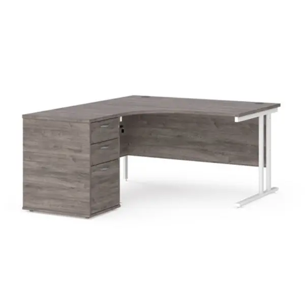 image of Maestro 25 left hand ergonomic desk 1400mm with white cantilever frame and desk high pedestal - grey oak