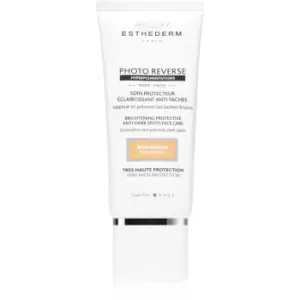 Image of Institut Esthederm Photo Reverse Brightening Protective Anti-Dark Spots Face Care Anti-Dark Spots Protective Cream High Sun Protection Shade Medium Be