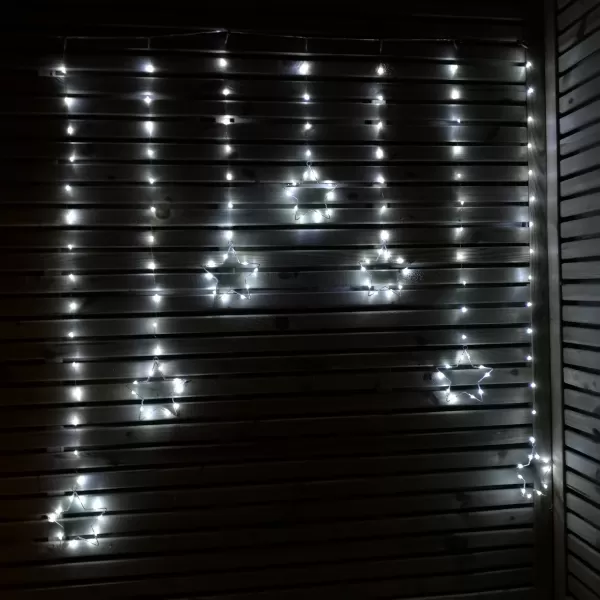 image of 1.2m Battery Operated Christmas Star Curtain Lights with 140 White LEDs