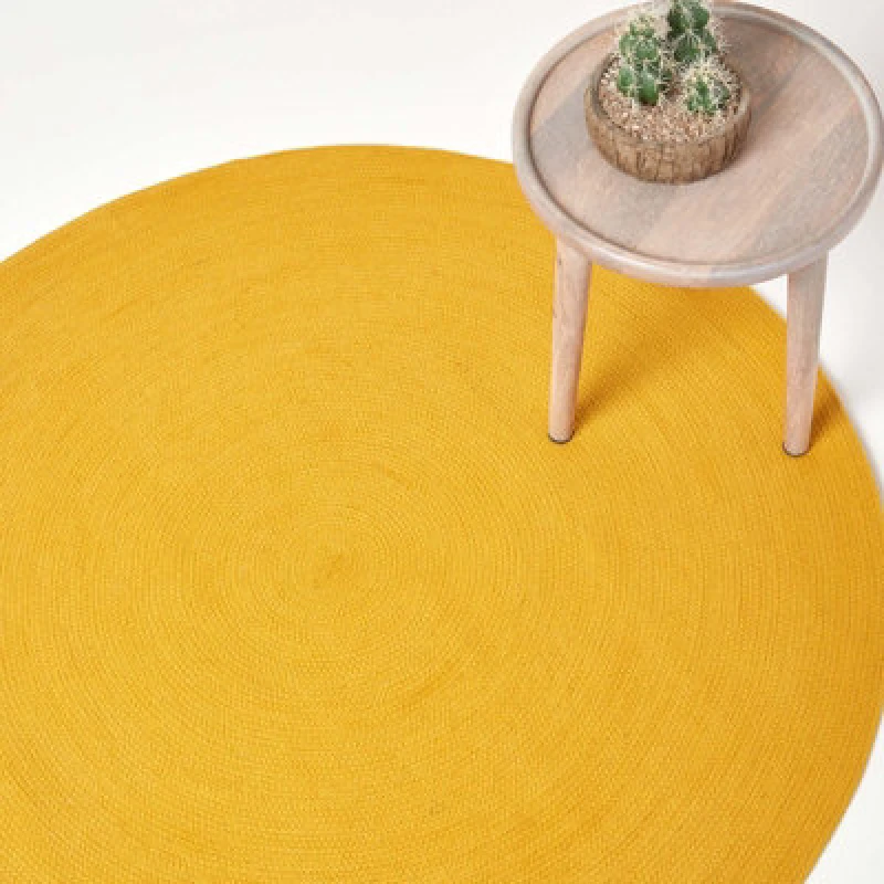 Image of HOMESCAPES Homescapes - Mustard Yellow Handmade Woven Braided Round Rug, 120cm RU1335C