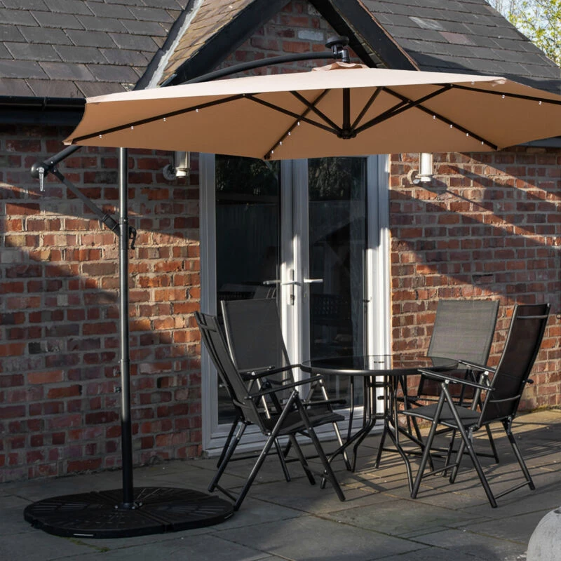 Image of Outdoor 4 Person Round Glass Top Garden Dining Table Chairs With Beige Banana Lit Parasol and Base Set