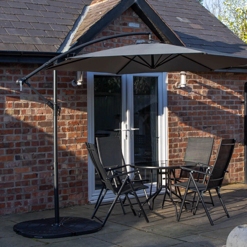 Image of Samuel Alexander Outdoor 4 Person Round Glass Top Garden Dining Table Chairs With Banana Parasol & Base in Grey Grey Unisex 4 Person