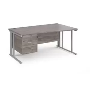 Image of Maestro 25 right hand wave desk 1600mm wide with 3 drawer pedestal - silver cable managed leg frame and grey oak top