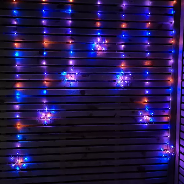 image of 1.2m Battery Operated Snowflake Curtain Christmas Lights with 147 Rainbow LEDs