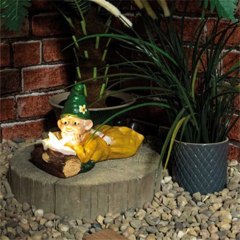 Image of Netagon Garden Outdoor Solar Powered Light Up Gnome Log Reading Ornament Decoration