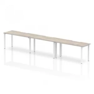 Image of Single White Frame Bench Desk 1400 Grey Oak (3 Pod)