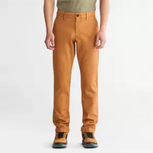 Image of Timberland Sargent Lake Stretch Chino Trousers For Men In Orange Yellow, Size 38x32