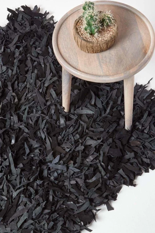 Image of Homescapes Dallas Leather Shaggy Rug in Black Size: 120cm x 180cm Black Unisex 120cm x 180 cm