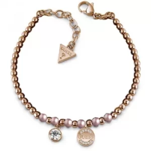 image of GUESS rose gold plated bead bracelet with pink Swarovski pearls, Swarovski crystal charm and logo coin charm.