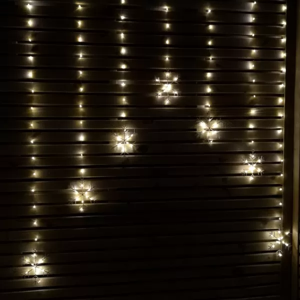 image of 1.2m Battery Operated Snowflake Curtain Christmas Lights with 147 Warm White LEDs