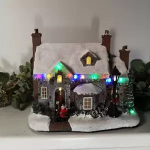 image of 27cm Light Up Multi Coloured Christmas House Scene With Lamp Battery Operated