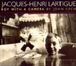 Image of Boy with a camera by John Cech