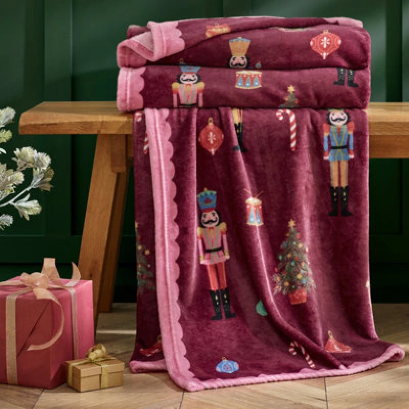 Image of Catherine Lansfield Christmas Nutcracker Fleece Cosy 130X170Cm Blanket Throw Plum