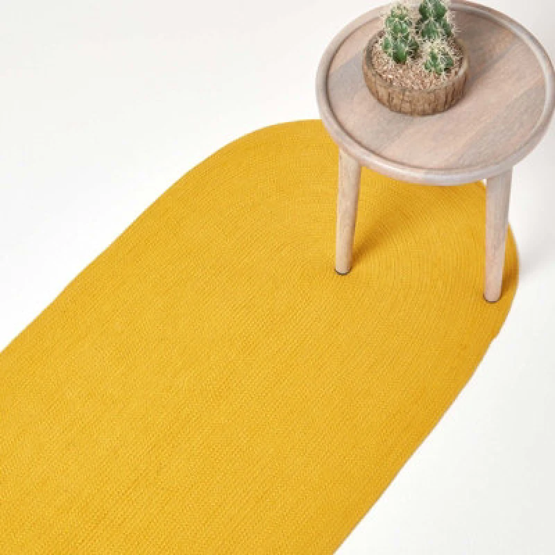 Image of Homescapes Handmade Woven Braided Oval Hallway Rug, 66 x 200cm Mustard