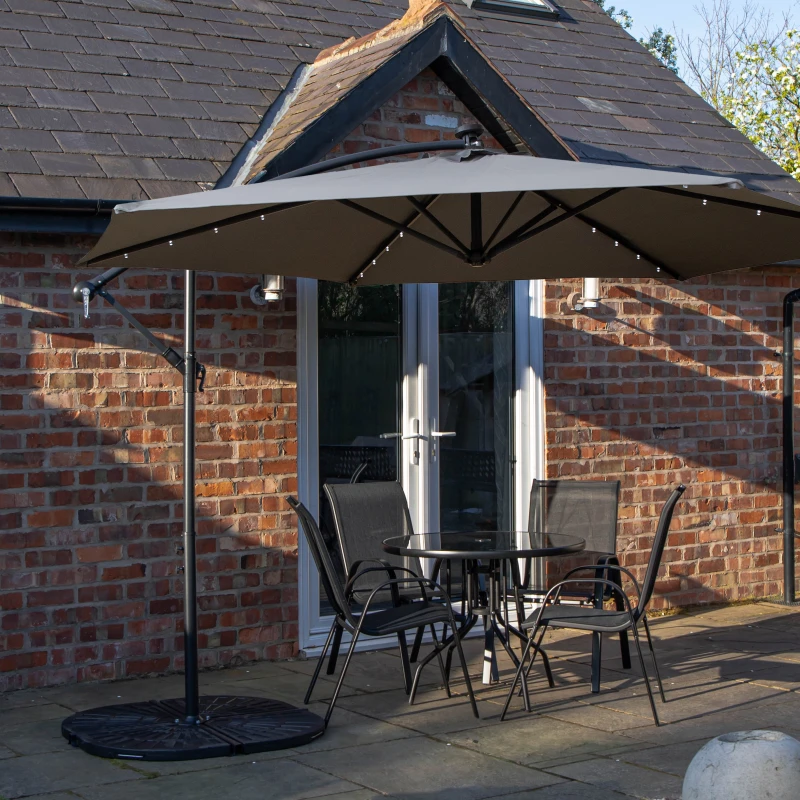 Image of Outdoor 4 Person Round Glass Top Garden Dining Table Chairs With Grey Banana Lit Parasol and Base