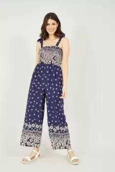 image of Navy Daisy Border Shirred Tie Jumpsuit