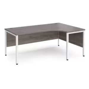 Image of Maestro 25 right hand ergonomic desk 1800mm wide - white bench leg frame and grey oak top