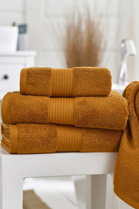 Image of Deyongs Deyongs Bliss Pima Supersoft Fluffy Cotton 650gsm Towels 2025 in Burnt Orange Size: Hand Towel Pair Burnt Orange Hand Towel Pair Unisex 5054